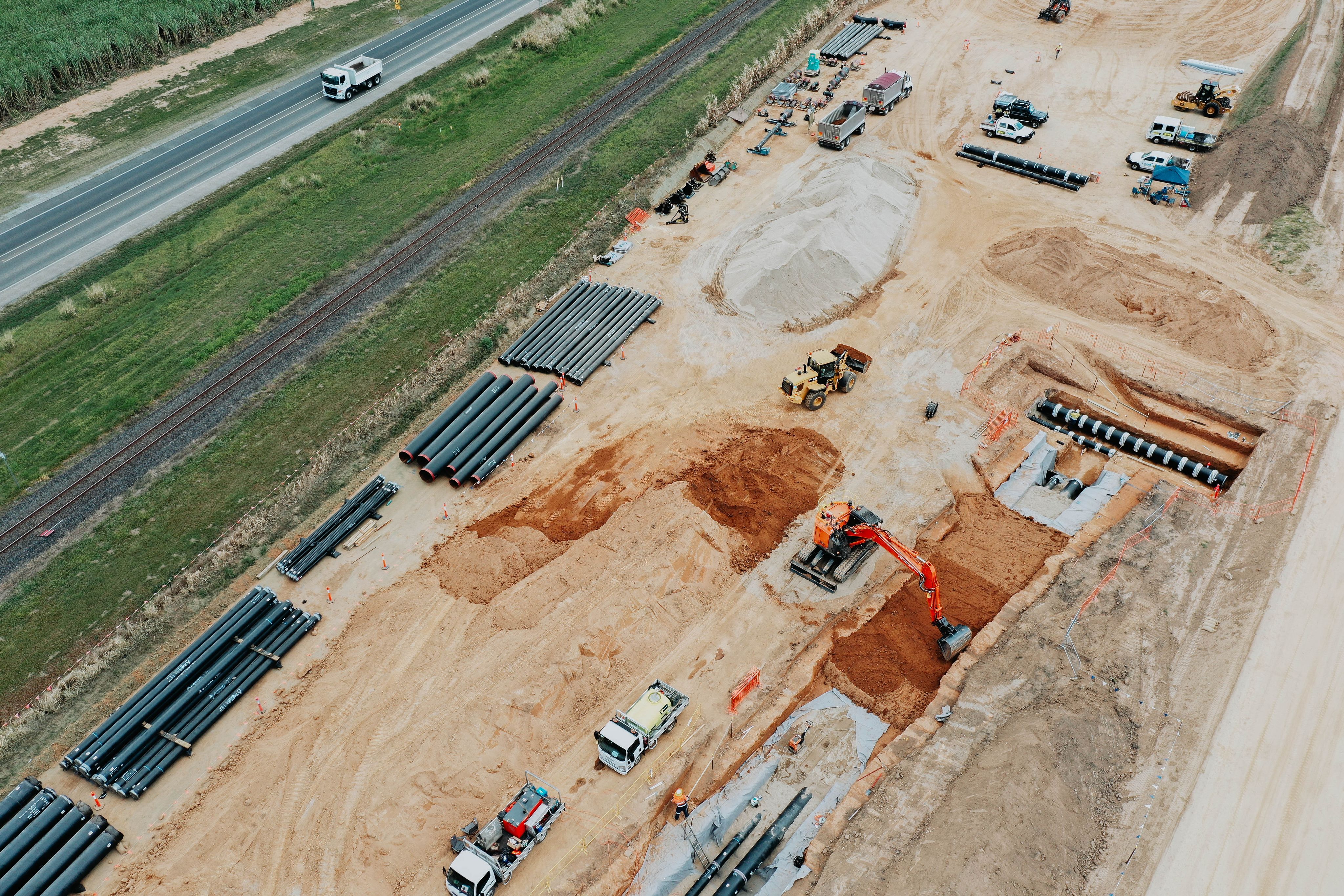 Aerial view of pipeline works alongside road and rail infrastructure